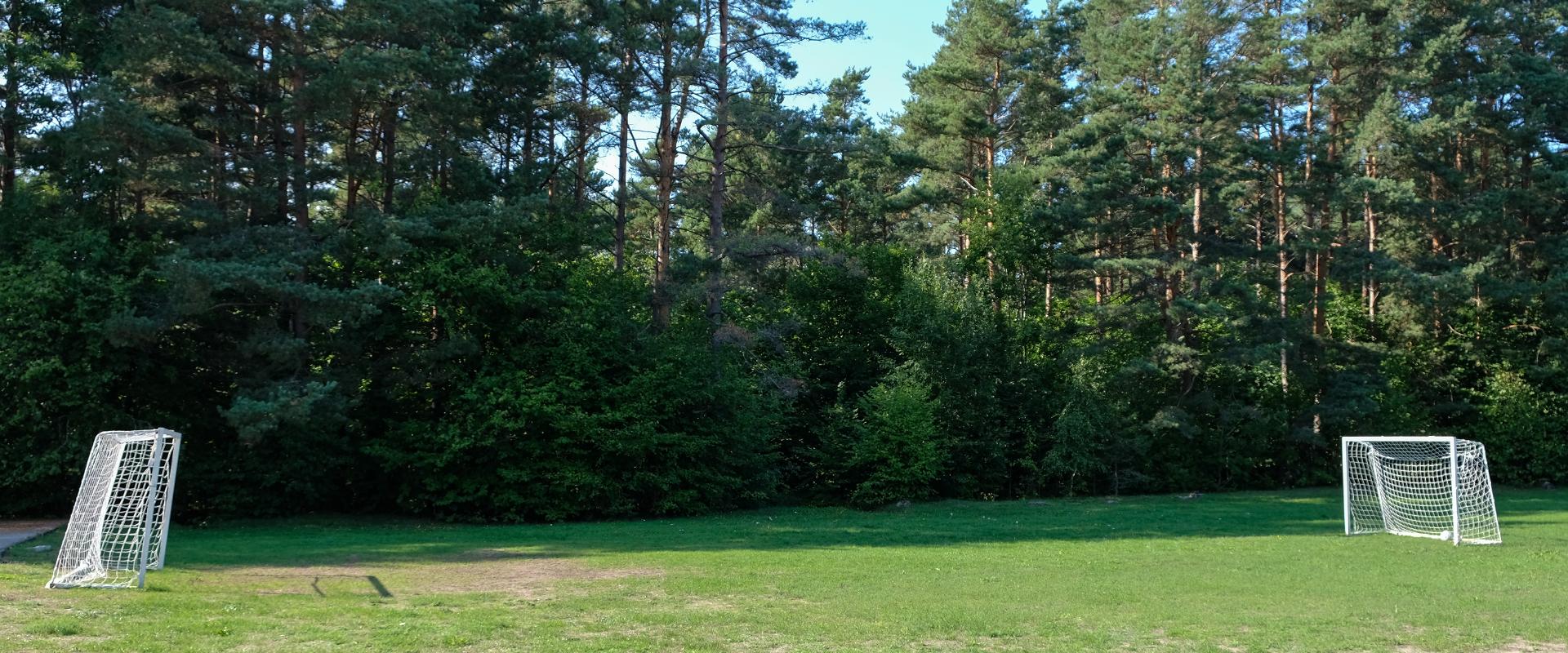 Tennis court and soccer field of the former community centre on Kihnu