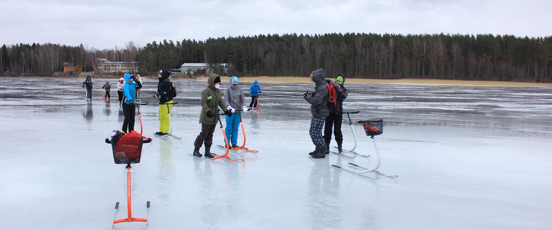 People on kicksleds on the frozen Lake Võrtsjärv
