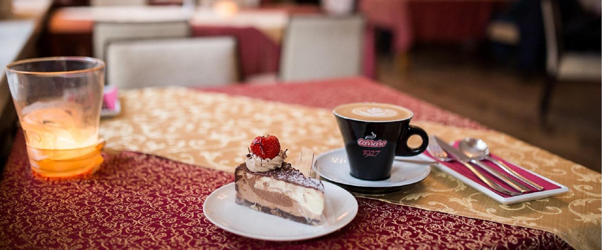 Werner Café, with a cake and a cup of coffee