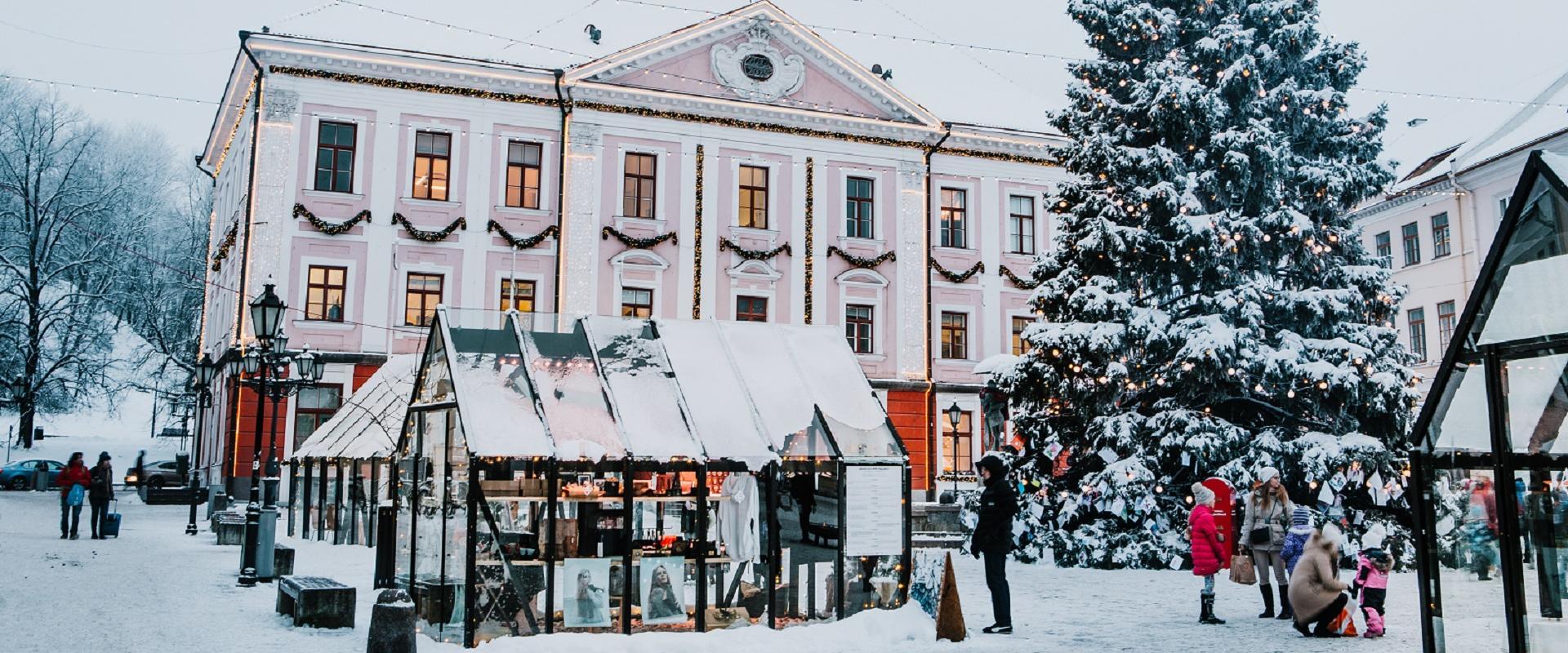 Tartu Town Hall Square and the snowy Christmas Village of Light with an ice rink