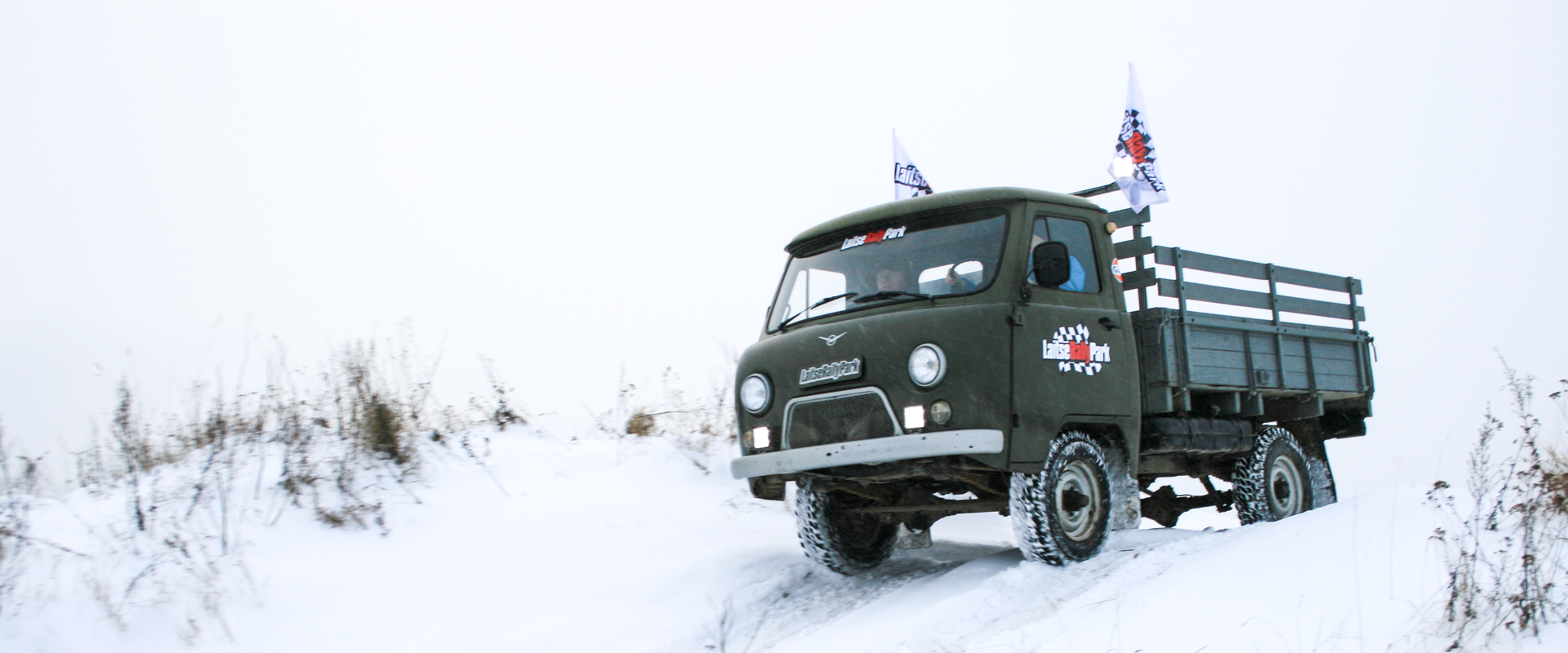 Driving an UAZ off-road vehicle on an obstacle course in LaitseRallyPark