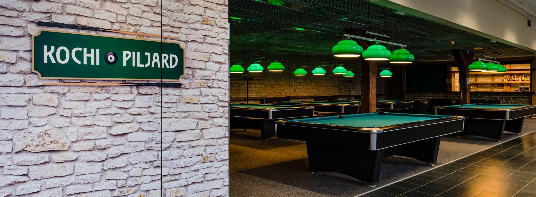 Billiards tables, green ceiling lamps