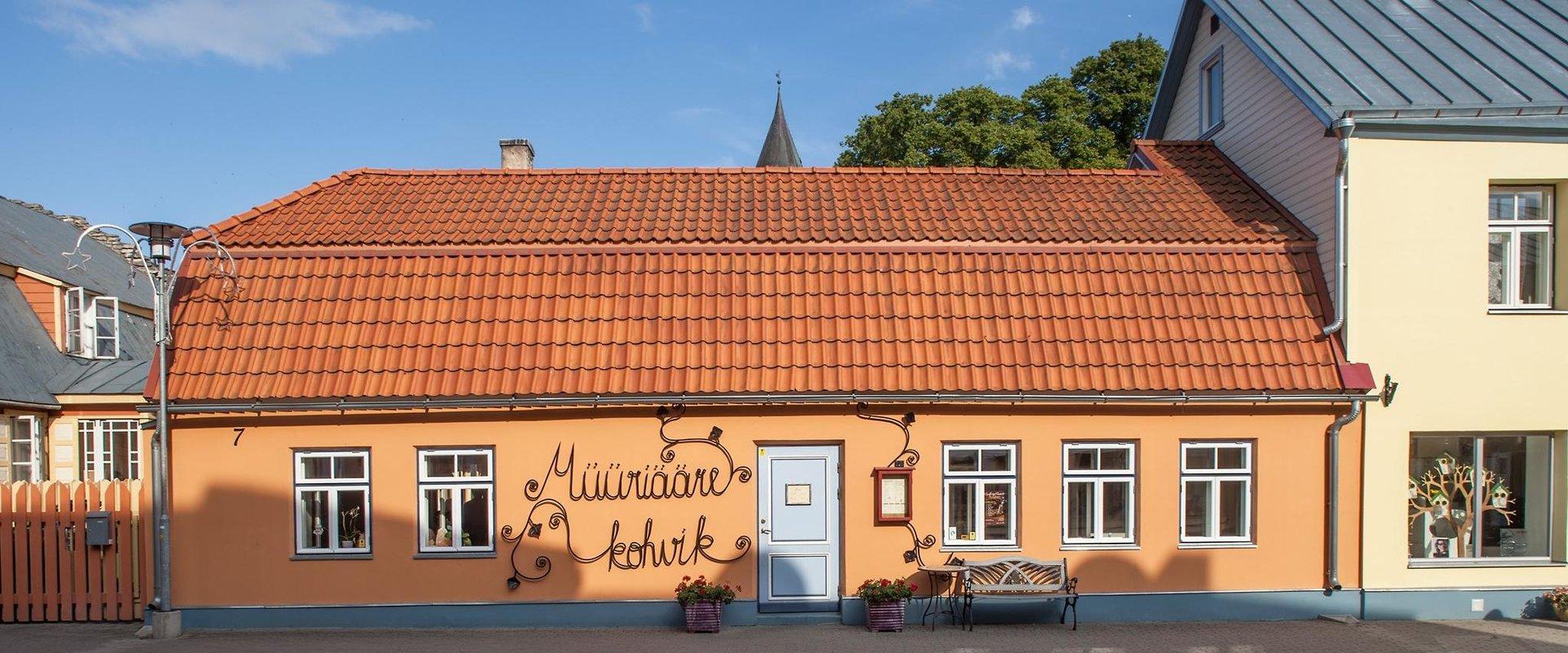 The highlighting features of Müüriääre Café are paintings by Epp-Maria Kokamägi, furniture by Jaak Arro and ceramics by Liisu Arro. As you walk in, th