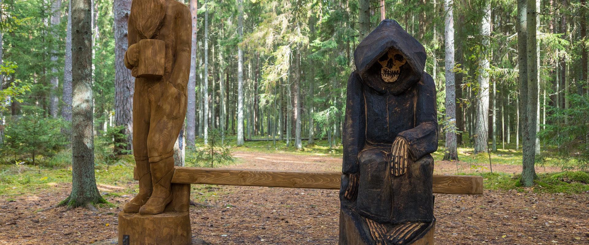 A sculpture about death and an old man located on the Nature Energy Trail