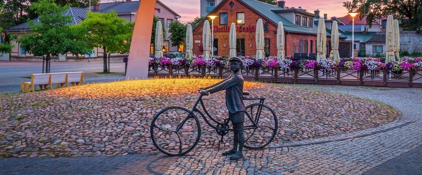 Sculpture ‘Young man on bicycle listening to music’