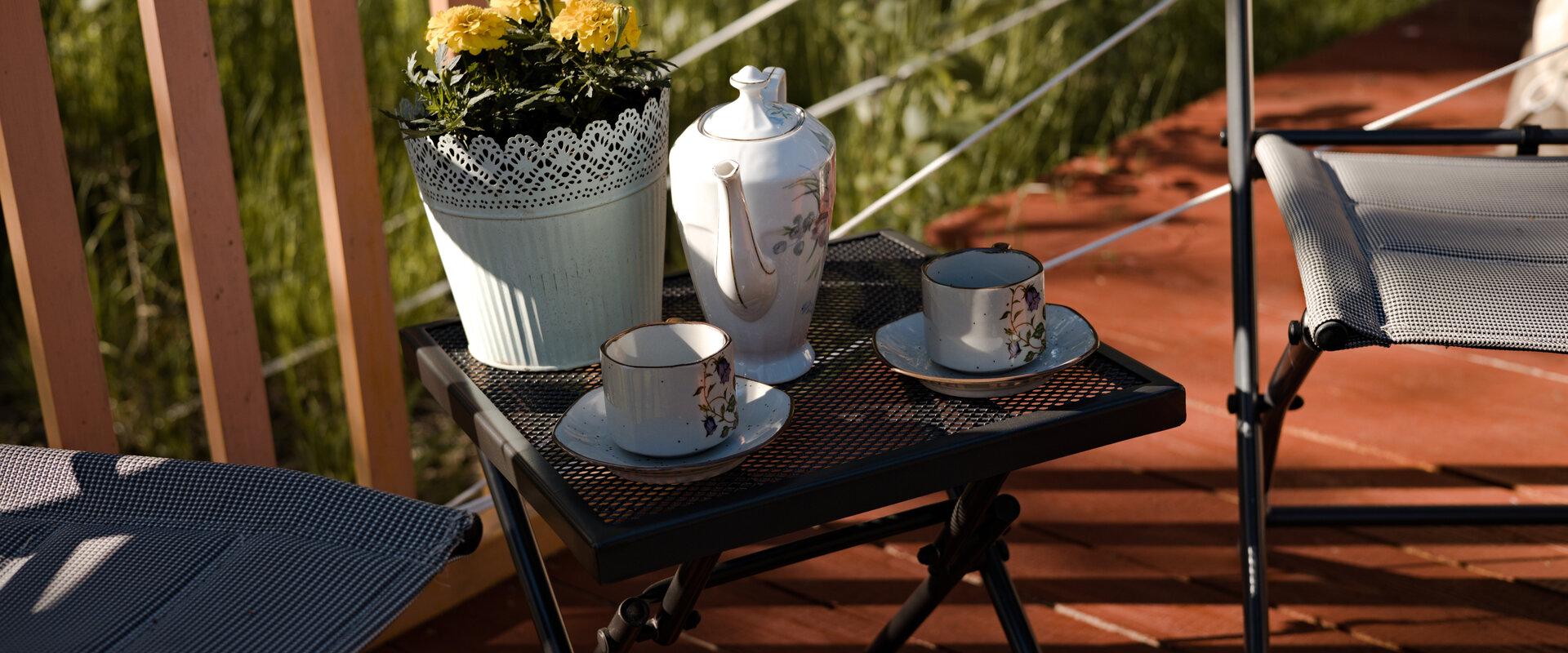 Laid coffee table in the Rannapungerja Glamping - you can enjoy your coffee at the terrace