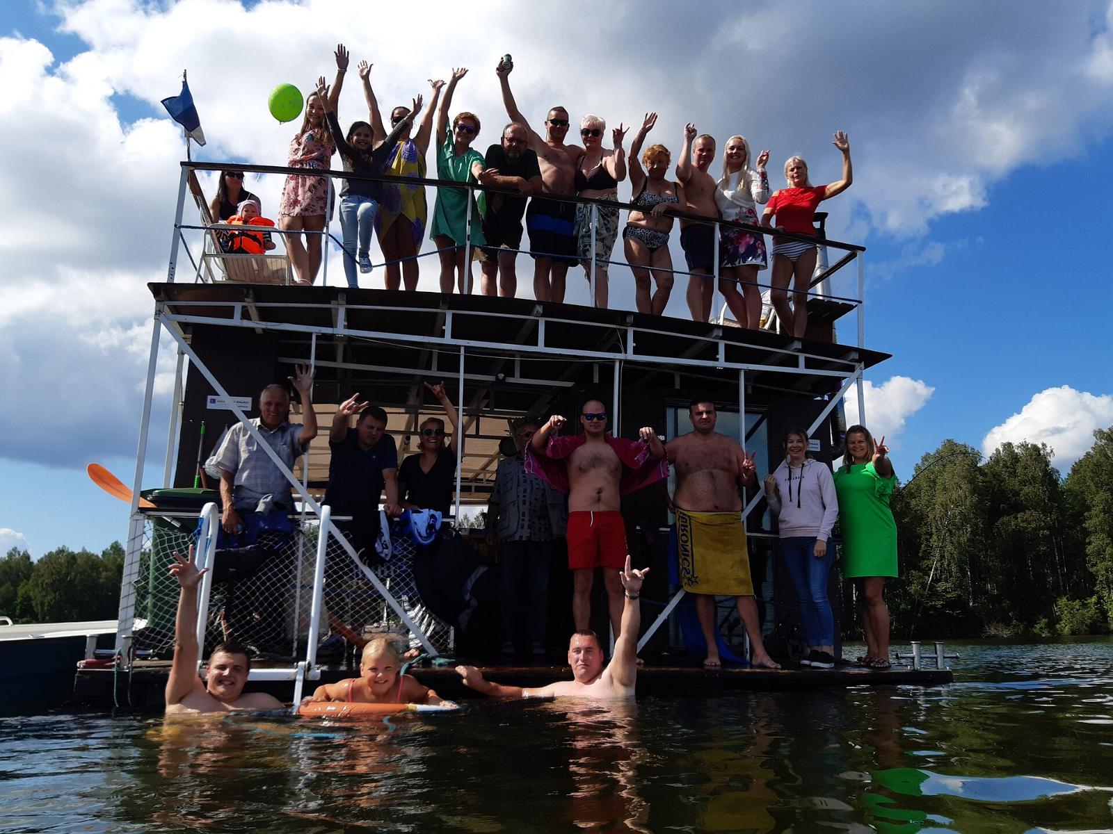 Happy passengers on the Raft Sauna on Lake Saadjärv
