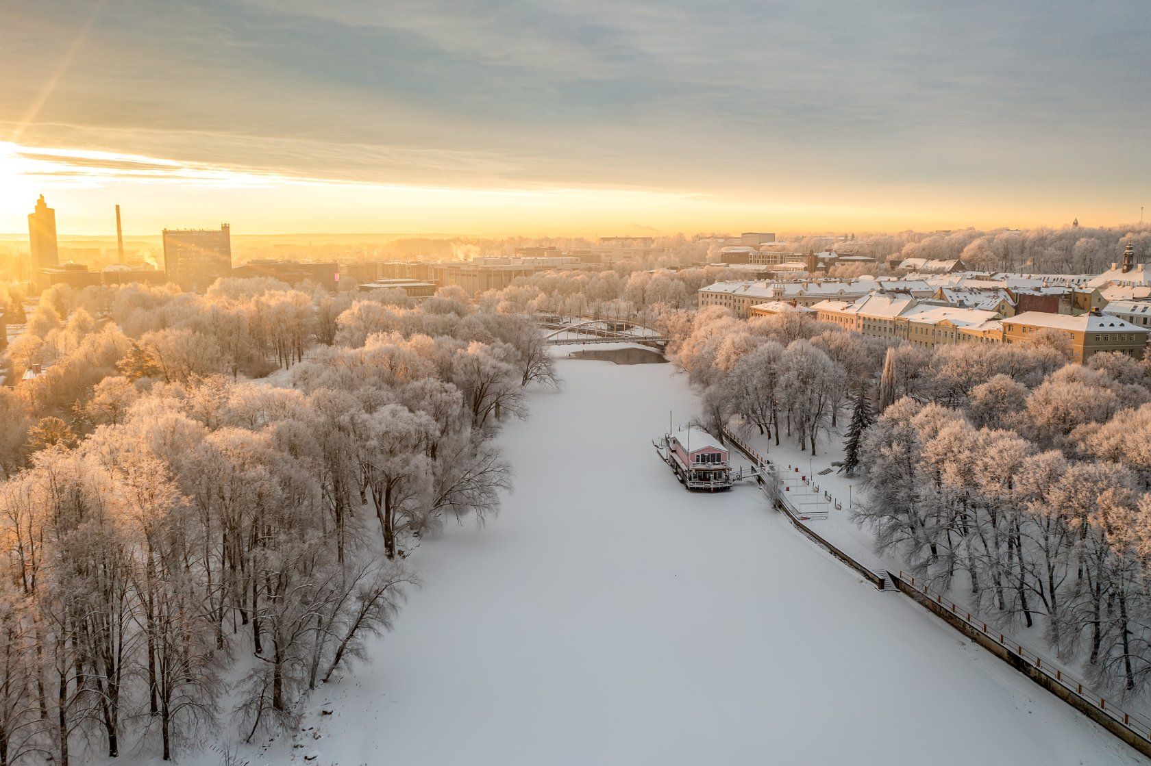 Ülejõe Promenade meandering along the bank of the River Emajõgi during a snowy wintertime