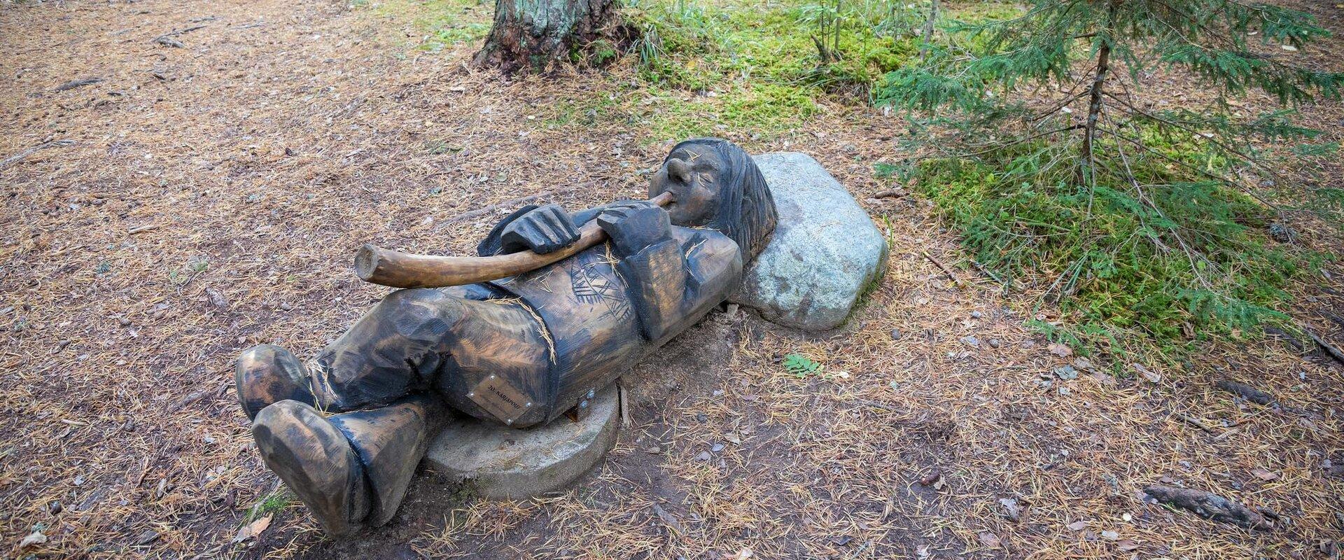 Sculpture of a herder at nature trail Väike Väerada