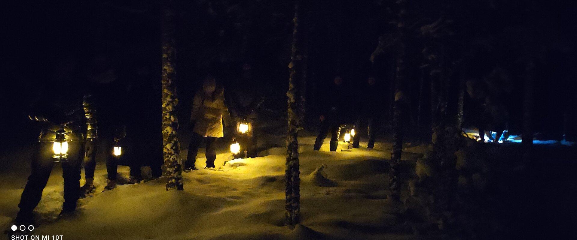 Lantern hike in pristine nature and campfire night