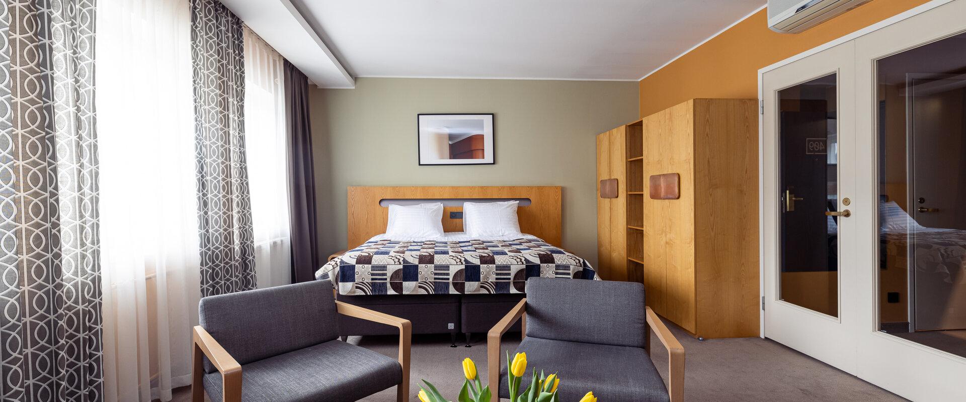 Deluxe Zimmer des Hotels Soho mit breitem Bett