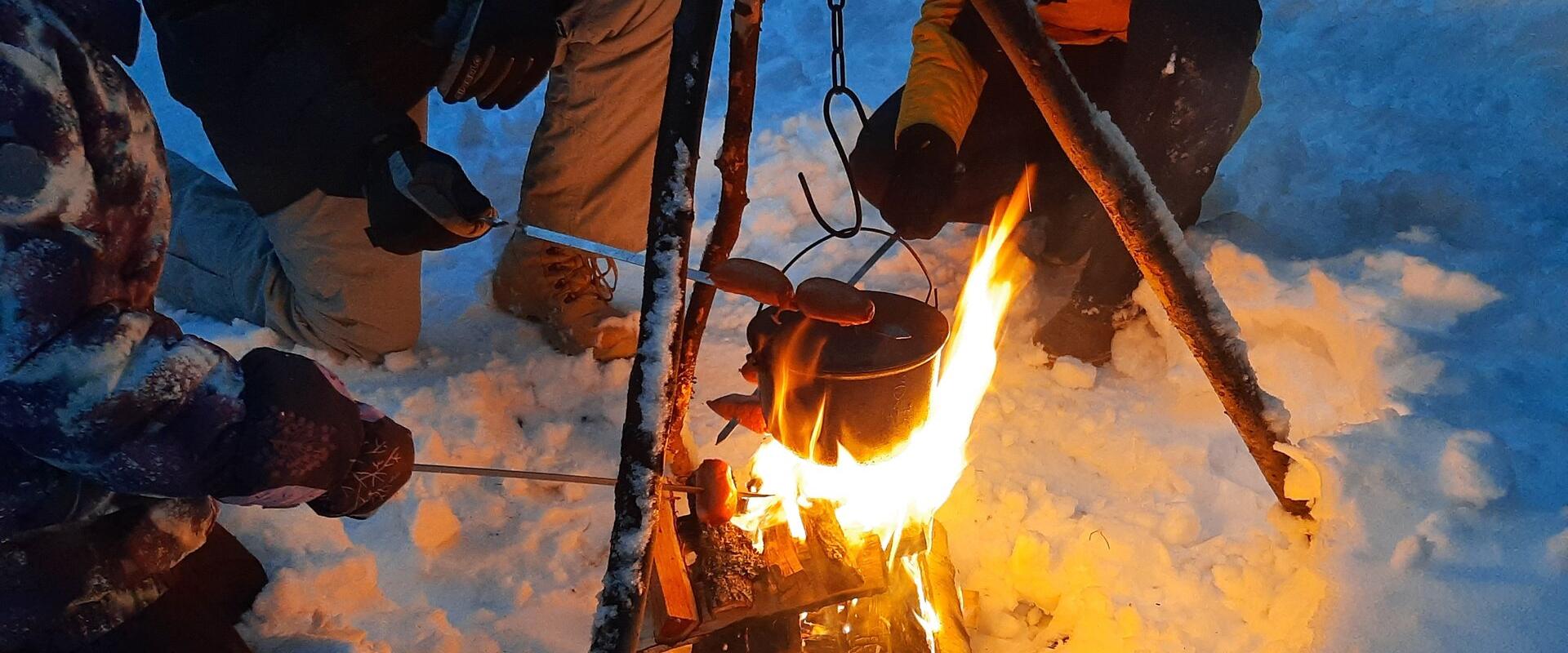 A walk in lantern light with a bonfire, where you can grill and eat.