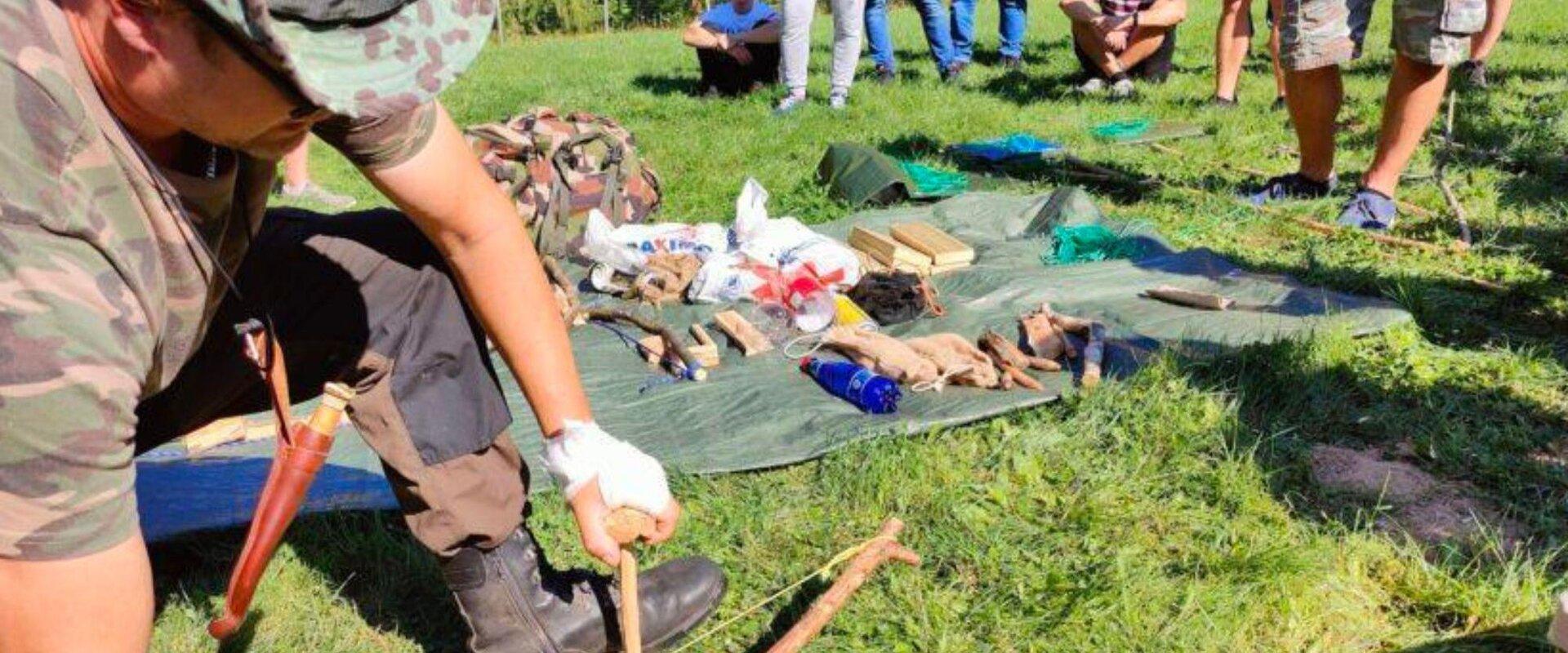 Making campfire wood in survival training