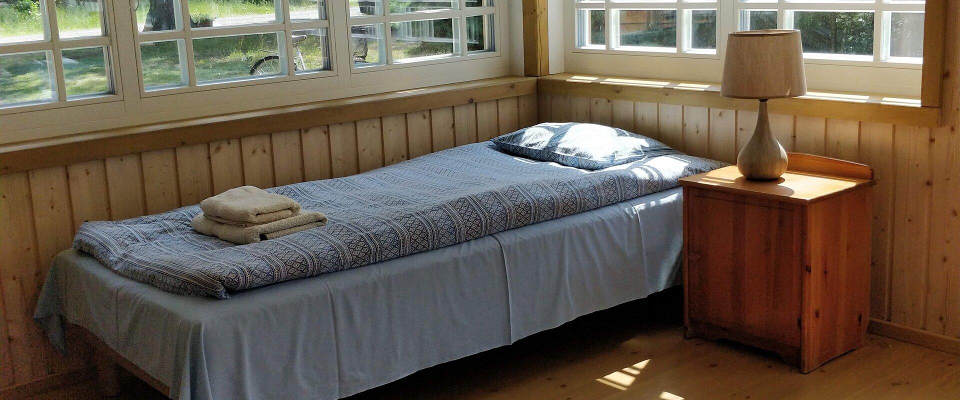 A bed in the Liise Farm porch room