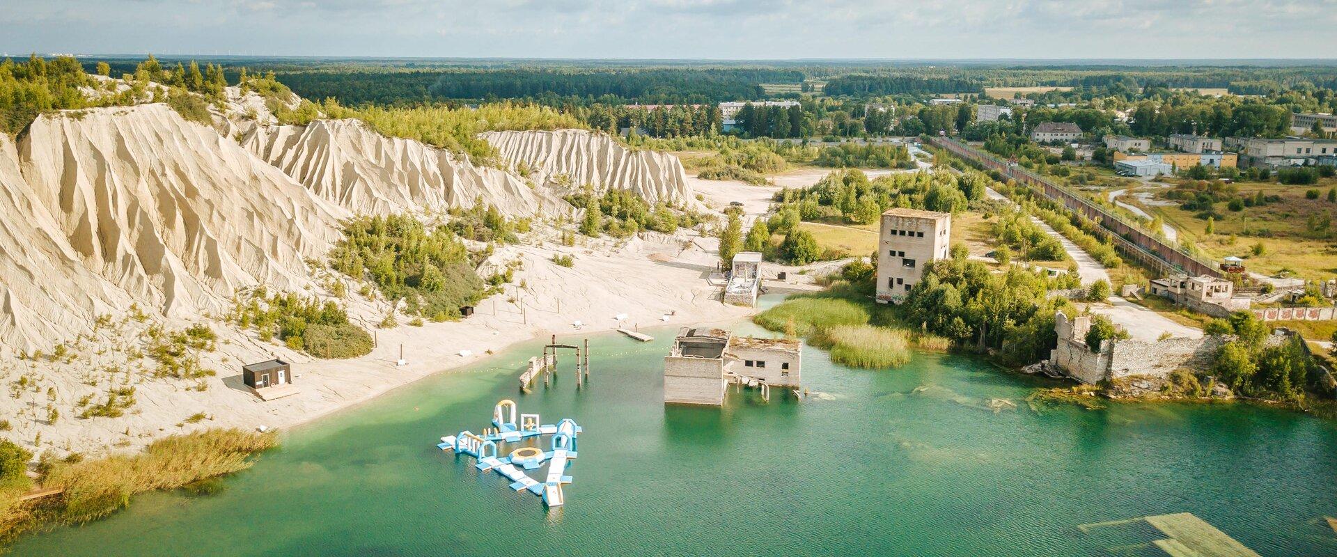 The crystal clear light greenish blue lagoon of Rummu quarry and the adjacent artificial hill are an unbelievably unique combination and an extraordin