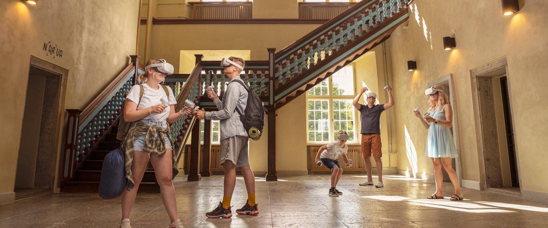 People in virtual reality glasses in the foyer of Narva City Hall