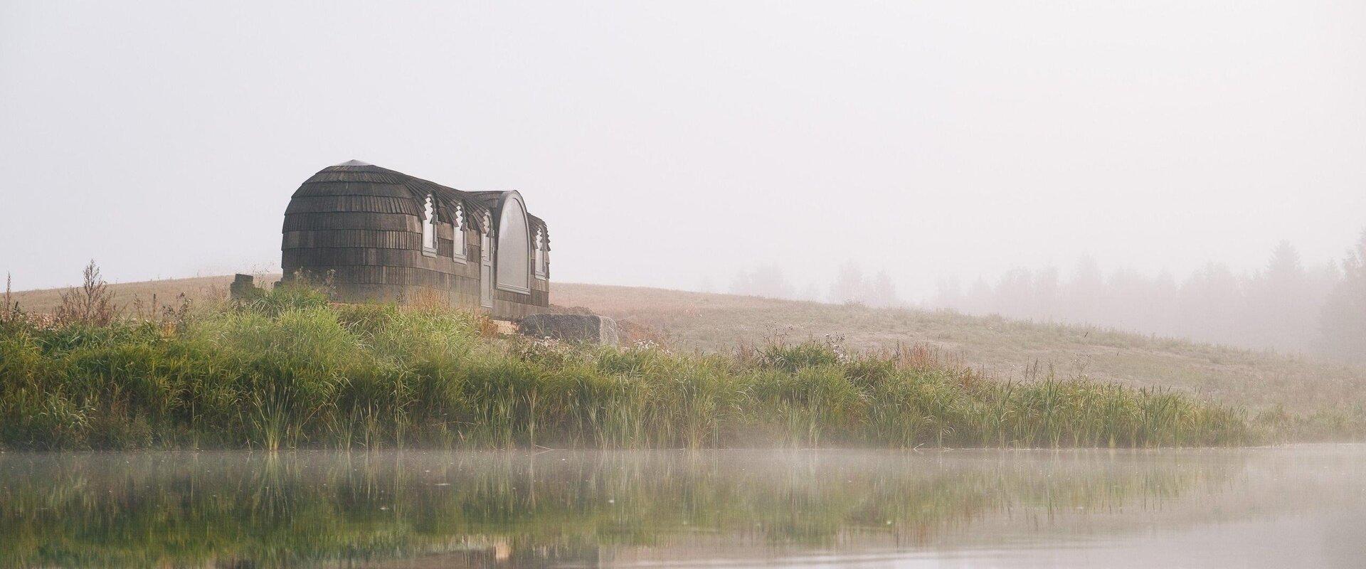 KODAS cozy igloo houses on the river bank