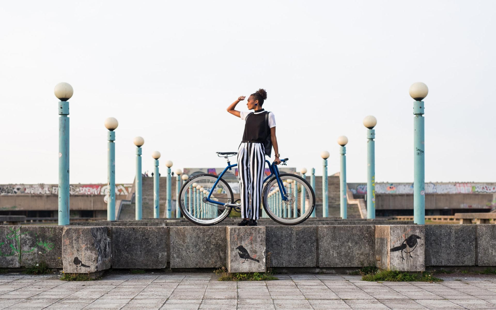 Linnahall - a woman with a bike enjoying a view