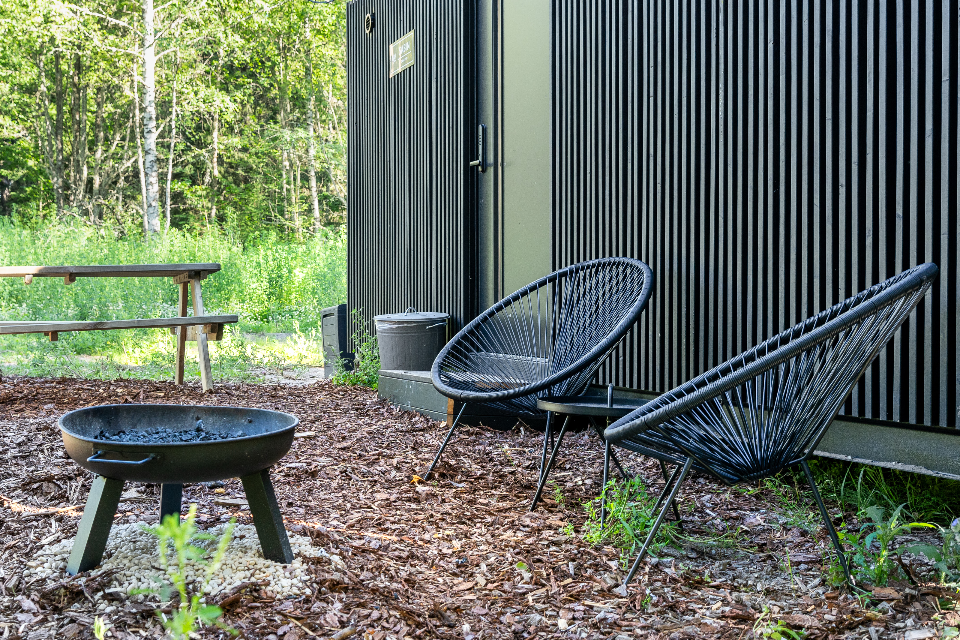 Wild Cabins -lomamökin nuotio- ja istuskelunurkkaus