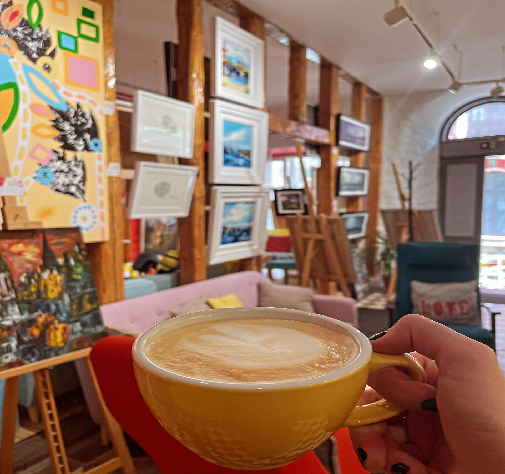 Rataskaevu 6 Art Gallery with coffee cup enjoying art