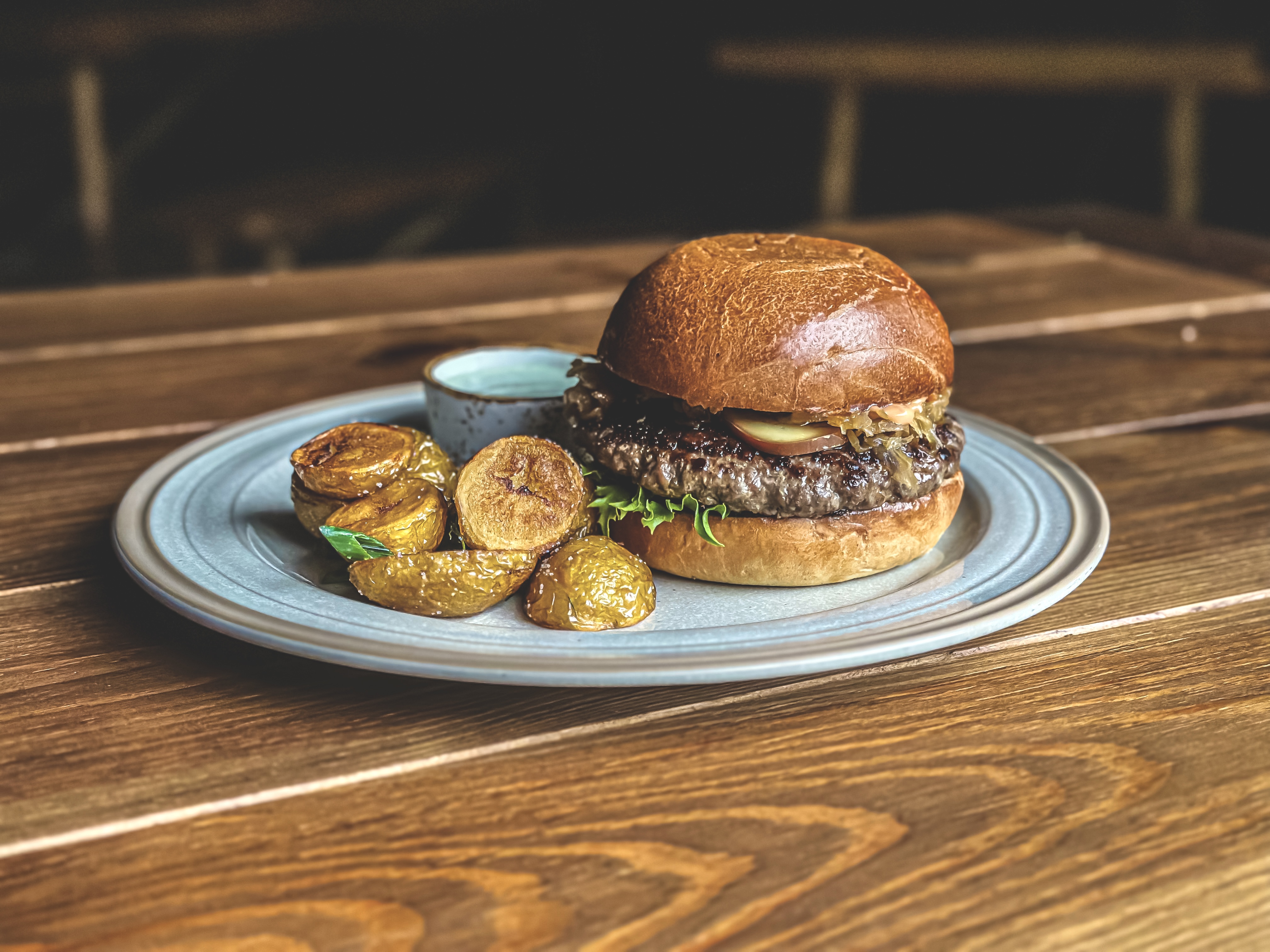 Local andmade burger with oven potatos Estonian cuisine