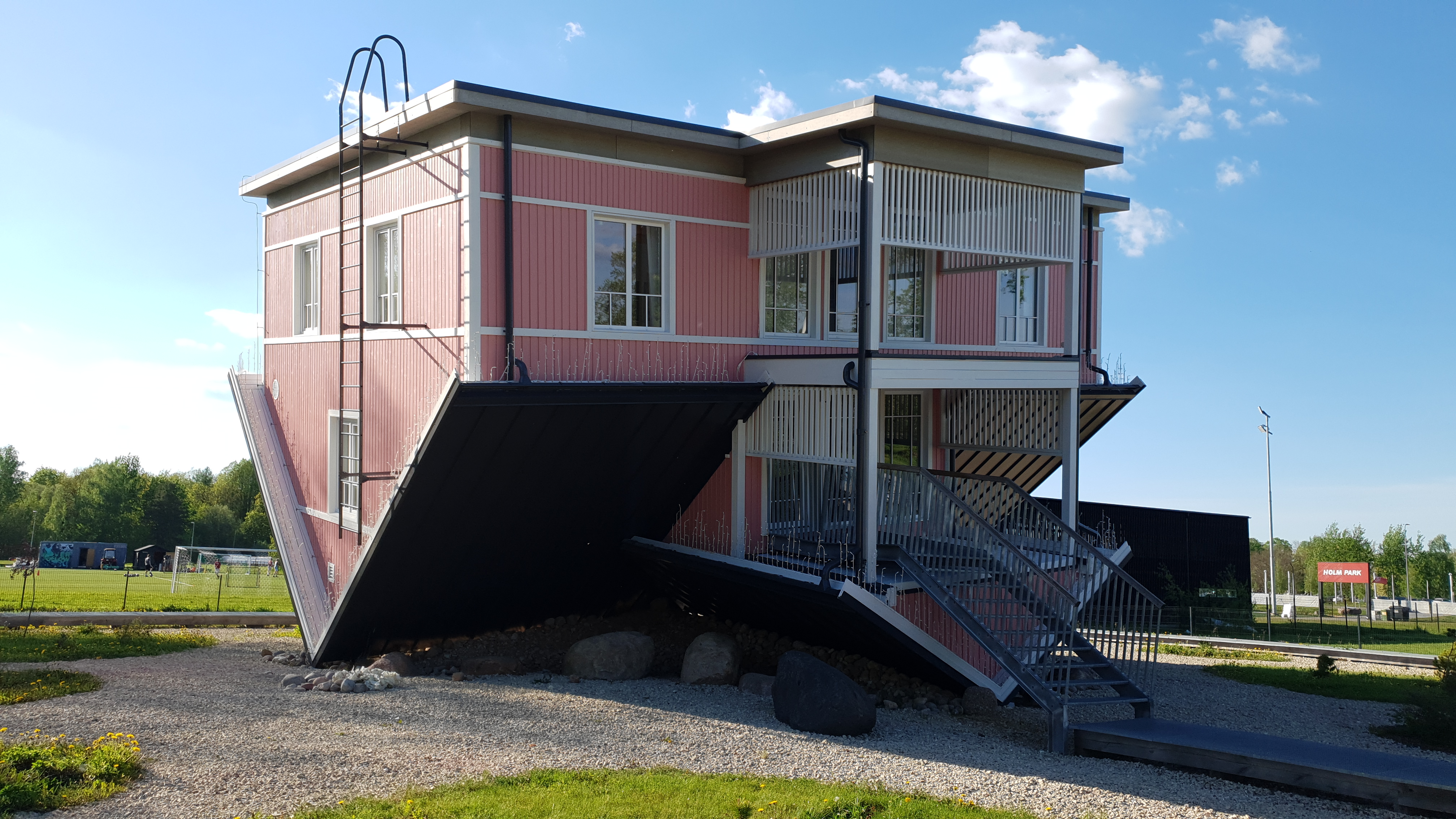 The Upside Down House with its cheerful pink exterior