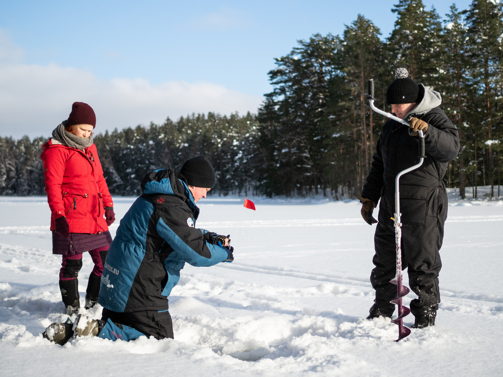 Teaching ice fishing on lake ice