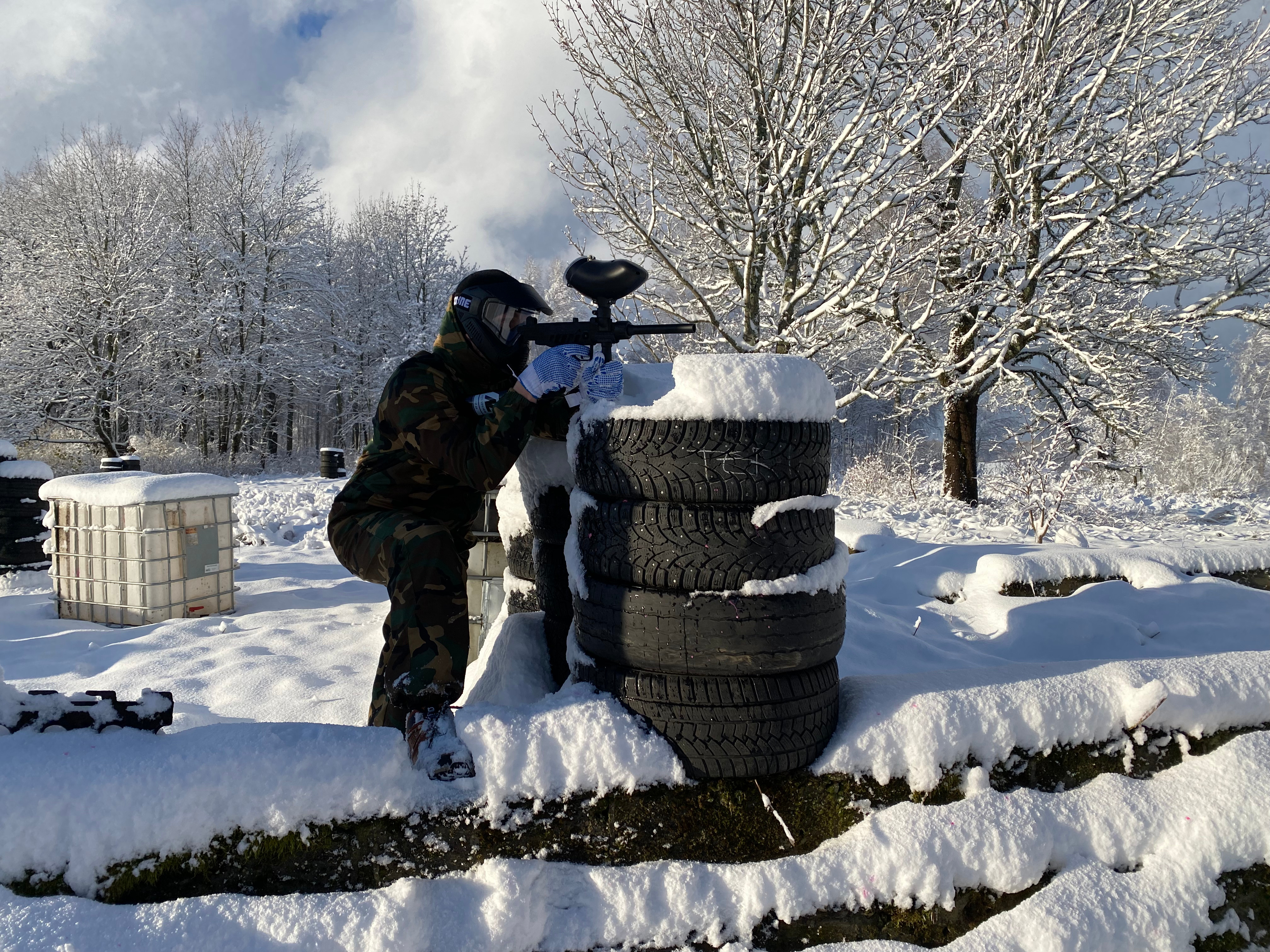 Paintball player awaiting enemy attack