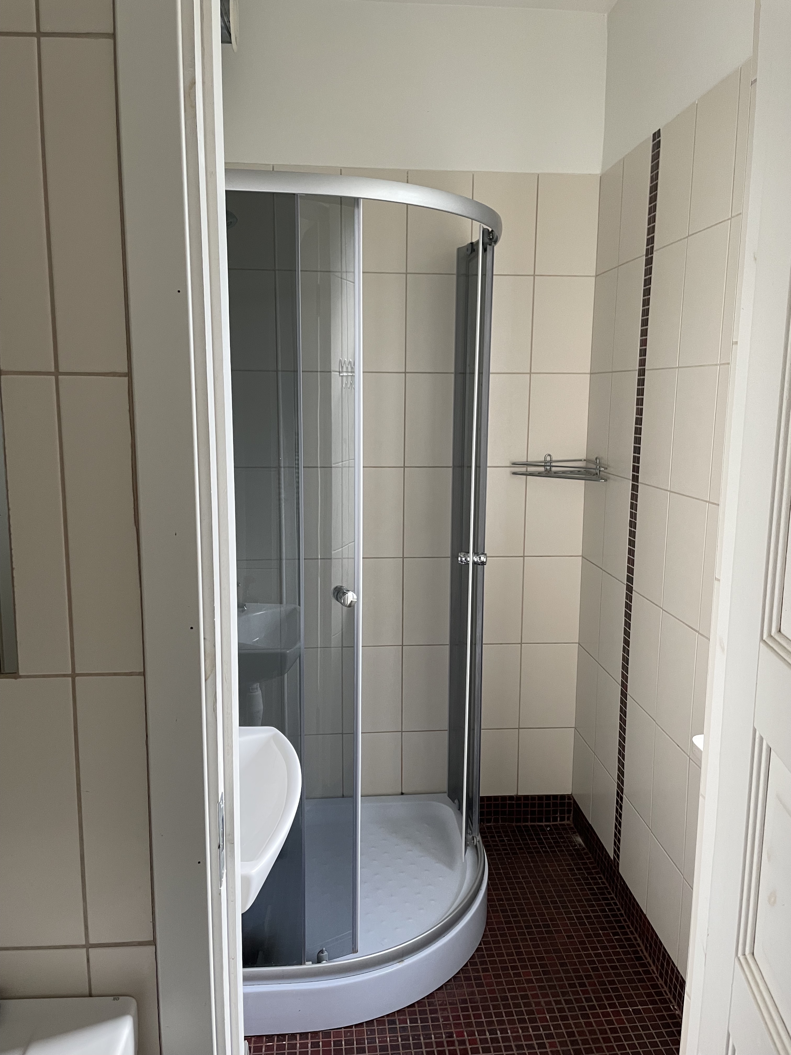 The shower corner in the second-floor bathroom