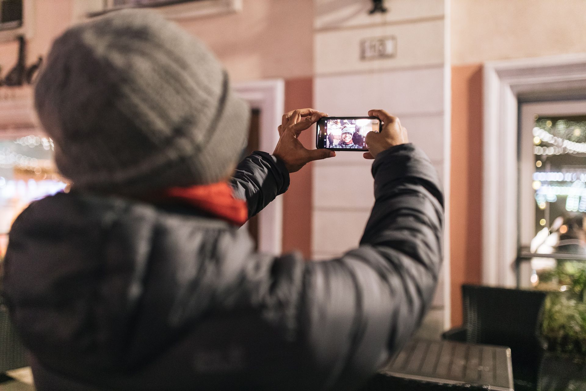 A man takes a picture of himself in Tallinn's Old Town