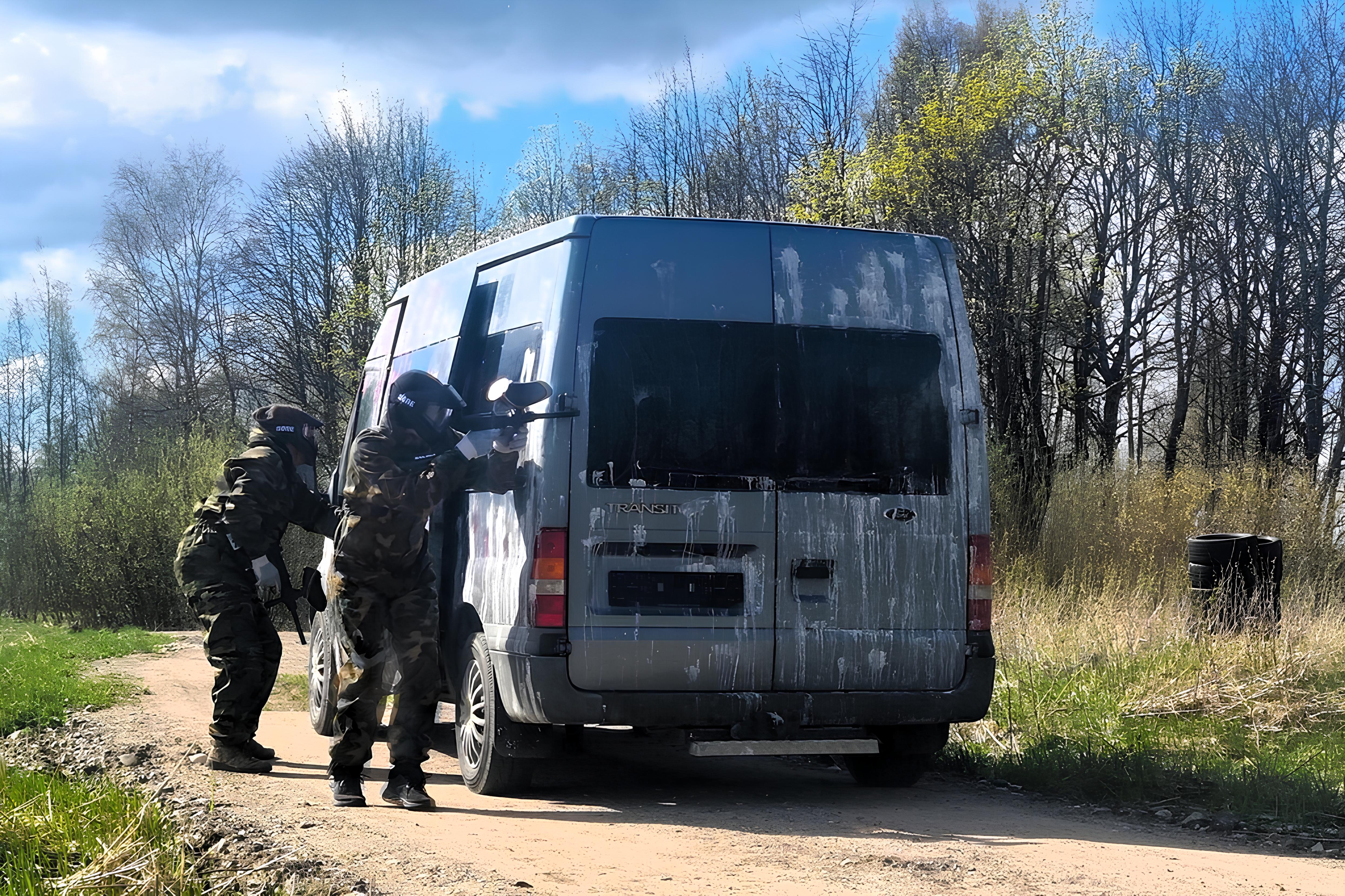 Paintball players are ambushing behind the car.