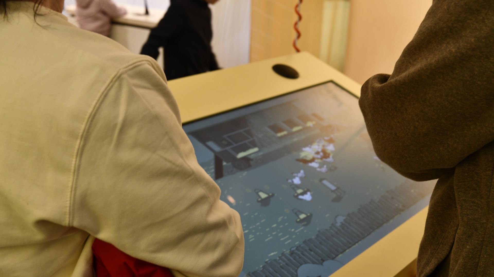 Visitors play an interactive game of raising chickens at Ülenurme Rural Curiosity Center