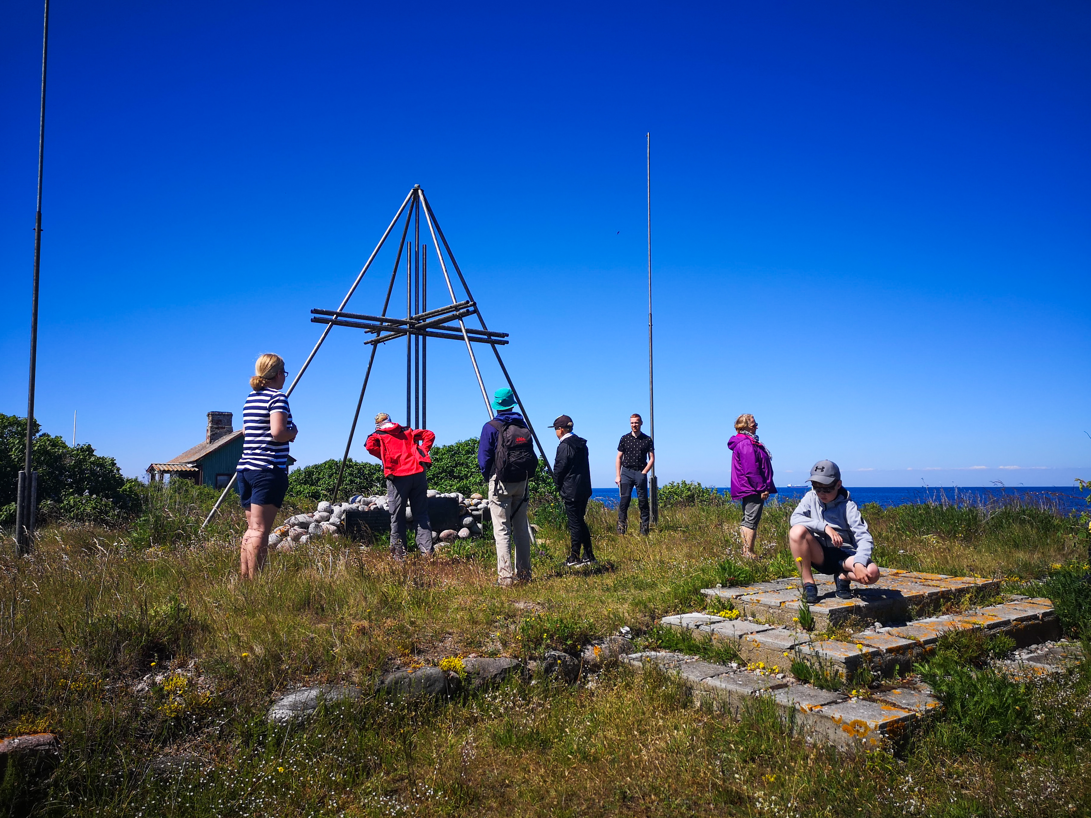 Guests exploring the monument erected on Keri.