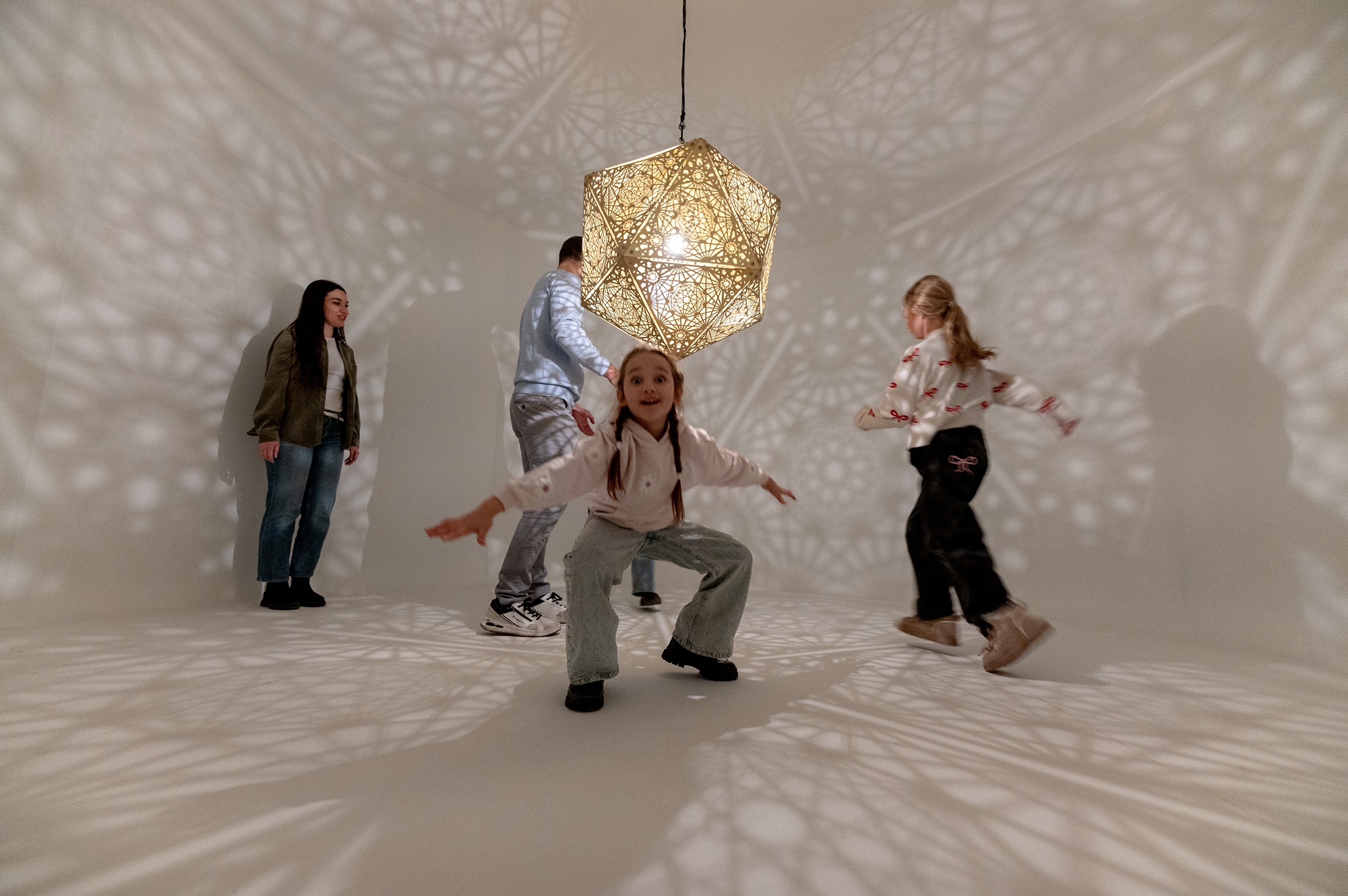 Children playing with shadows in the museum