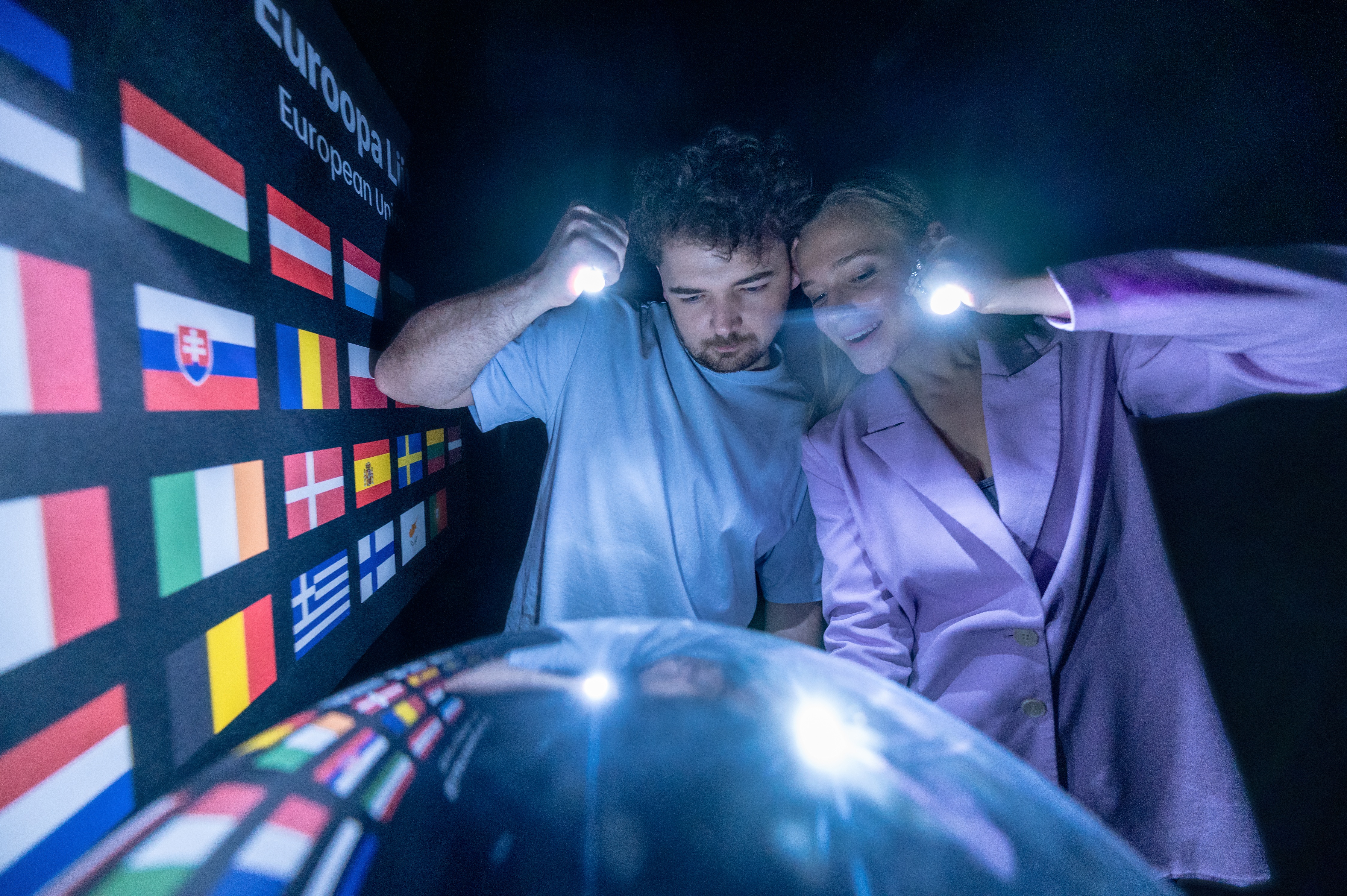 Visitors discovering optical illusions at the Museum of Illusions in Tallinn